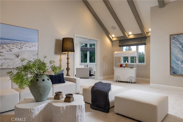 living area featuring light carpet, beam ceiling, and high vaulted ceiling