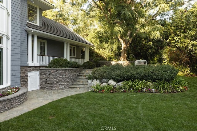 view of yard featuring a porch