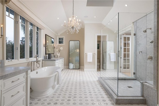 bathroom featuring vanity, crown molding, independent shower and bath, and vaulted ceiling