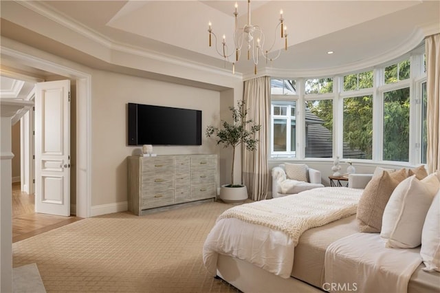 bedroom featuring light wood-type flooring, crown molding, and a notable chandelier