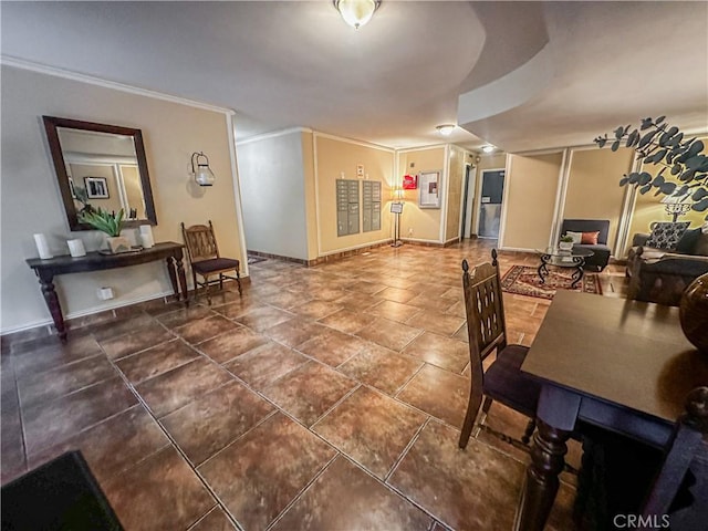 dining space featuring dark tile patterned flooring and ornamental molding