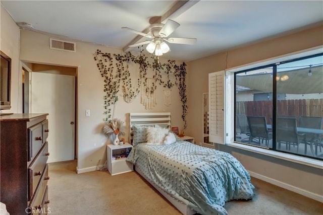 bedroom featuring ceiling fan and light carpet