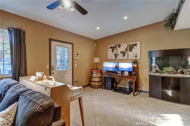 living room featuring light tile patterned floors, vaulted ceiling, and ceiling fan