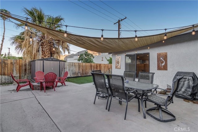 view of patio / terrace featuring grilling area and a storage shed