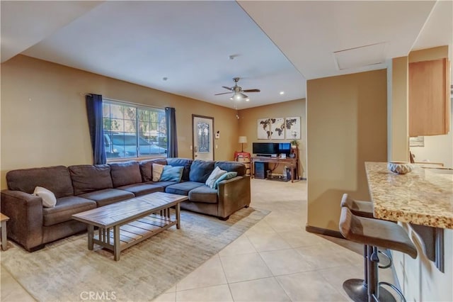 living room featuring light tile patterned flooring and ceiling fan