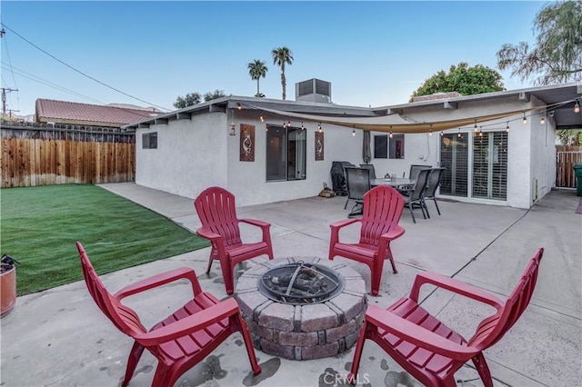 view of patio with a fire pit