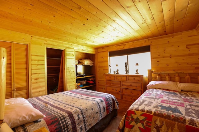 bedroom featuring multiple closets, wooden walls, and wooden ceiling