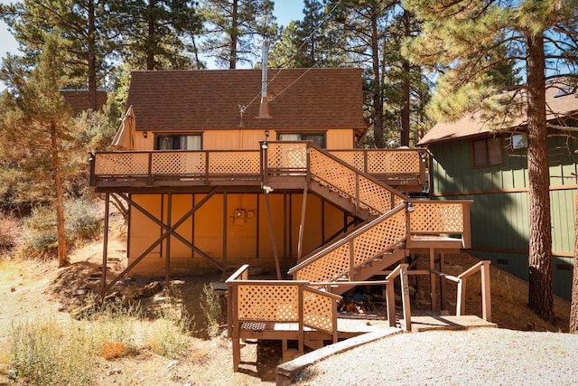 back of house featuring a wooden deck