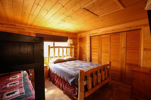 bedroom with carpet flooring, wood walls, and wood ceiling