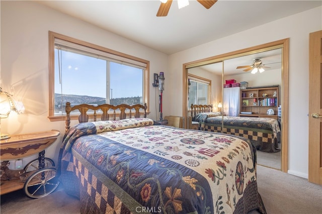 bedroom with ceiling fan, a closet, and carpet