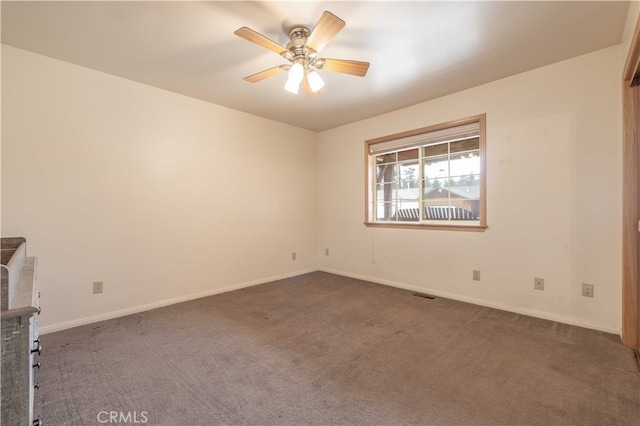 unfurnished room featuring carpet flooring and ceiling fan