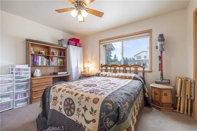 bedroom with ceiling fan and carpet