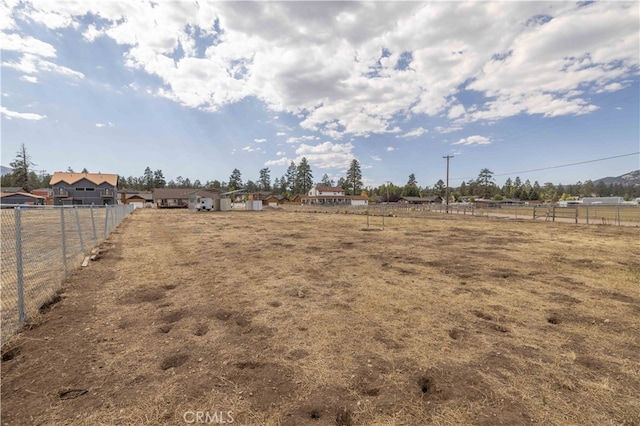 view of yard with a rural view