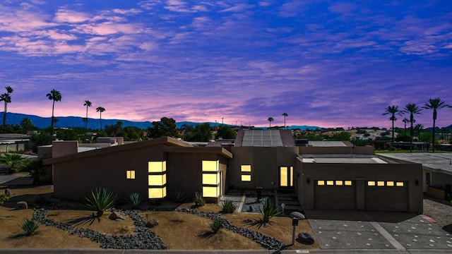 view of front of house featuring a mountain view and a garage