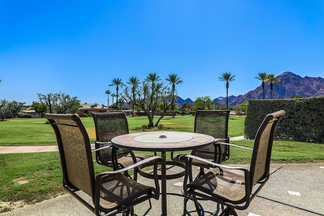 view of patio / terrace with a mountain view