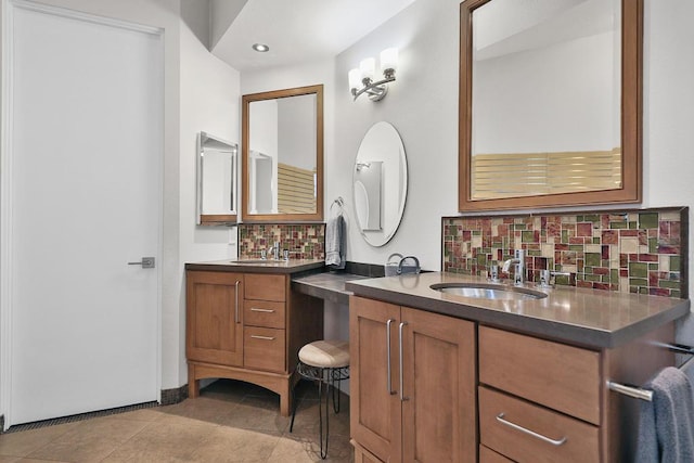 bathroom featuring backsplash, tile patterned floors, and vanity