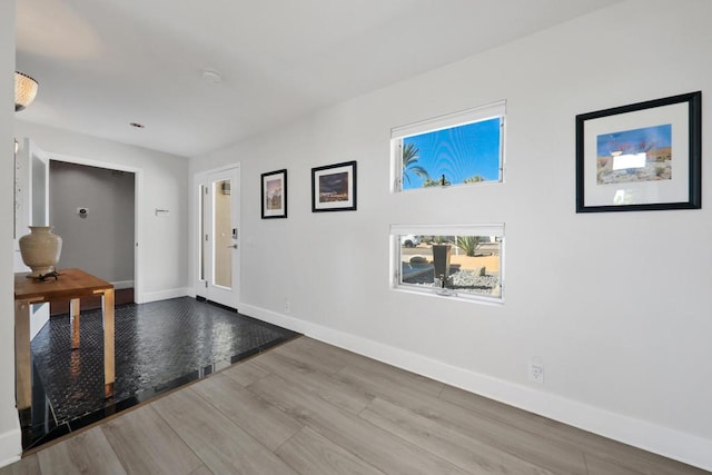 foyer entrance featuring hardwood / wood-style floors