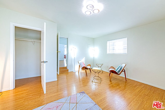 sitting room featuring light hardwood / wood-style floors