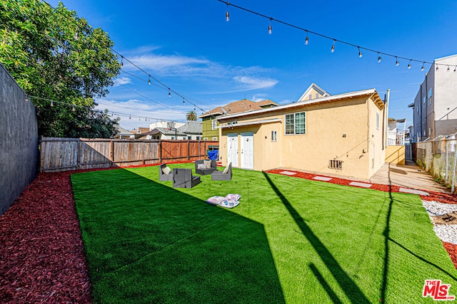 back of house featuring a yard