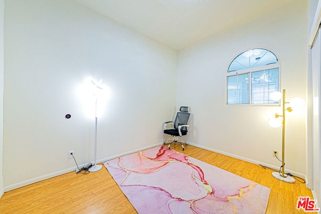 workout area with wood-type flooring