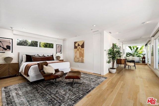 bedroom with light hardwood / wood-style floors