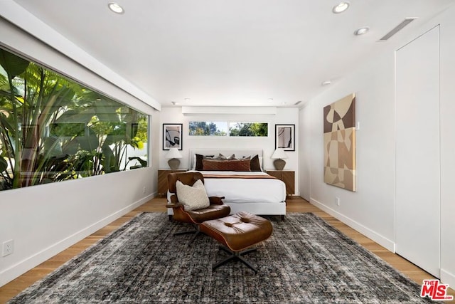 bedroom with light hardwood / wood-style flooring