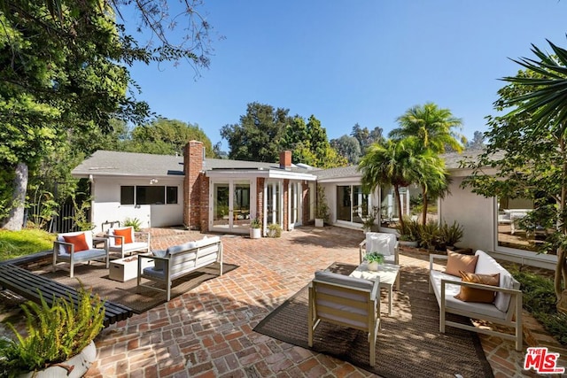 back of house featuring an outdoor hangout area, a patio, and french doors