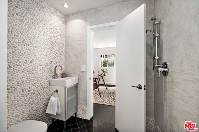 bathroom with tile patterned floors, toilet, and sink