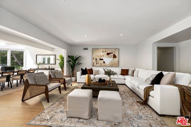 living room with light hardwood / wood-style floors