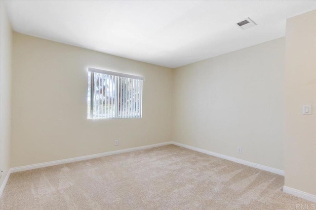 empty room with light colored carpet