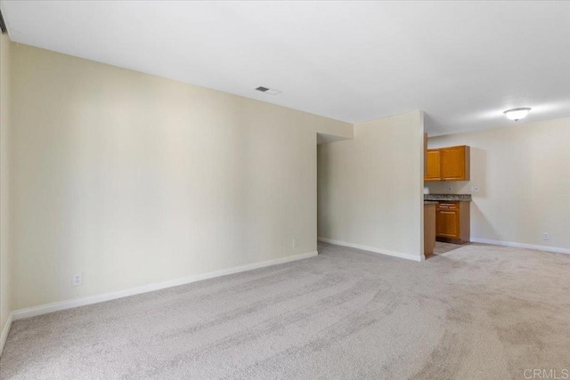 unfurnished living room with light carpet