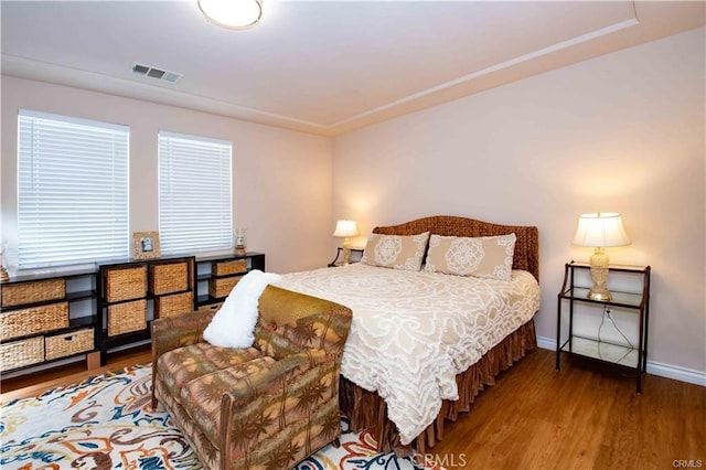 bedroom with wood-type flooring