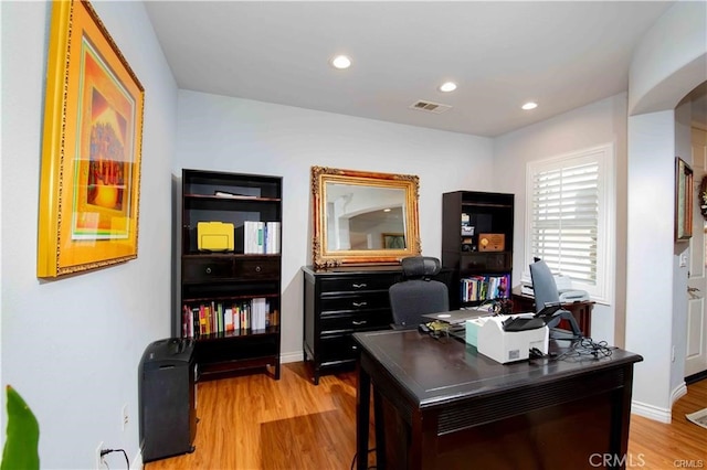 home office with light wood-type flooring