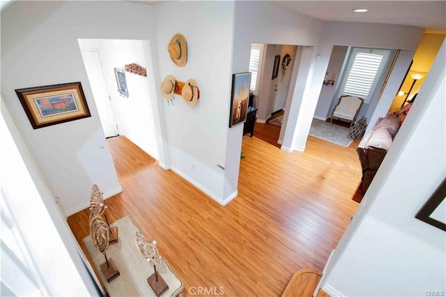 hallway with light hardwood / wood-style flooring