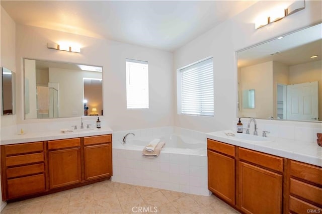 bathroom featuring vanity, plus walk in shower, and tile patterned flooring