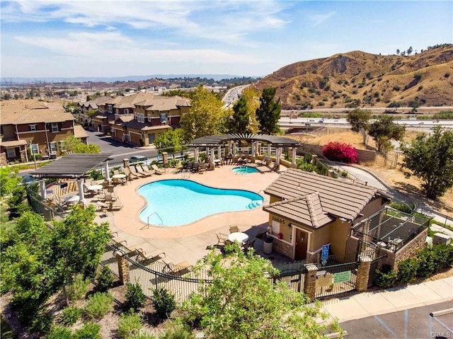 view of pool with a mountain view and a patio area