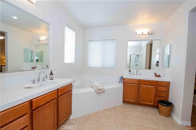 bathroom featuring vanity, plus walk in shower, and tile patterned flooring