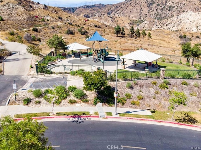 birds eye view of property featuring a mountain view