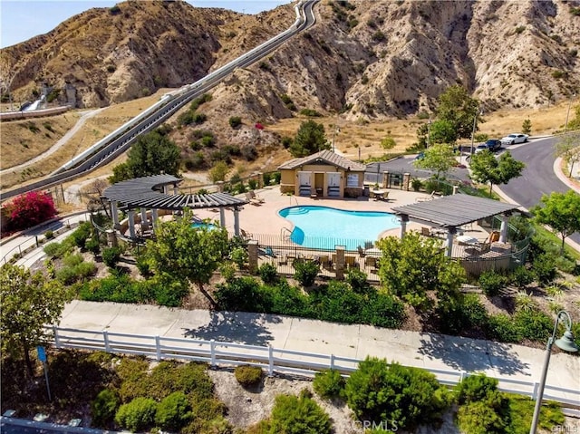 view of pool with a mountain view, a gazebo, and a patio