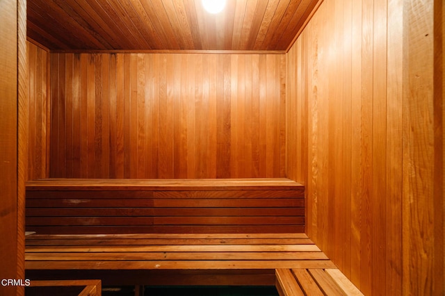 view of sauna / steam room with wood walls and wood ceiling