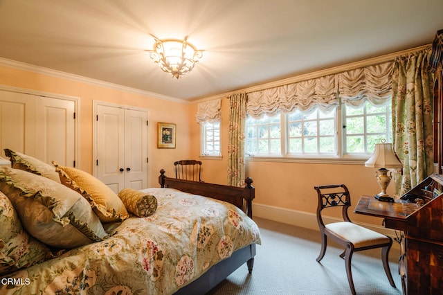 bedroom with crown molding and carpet flooring