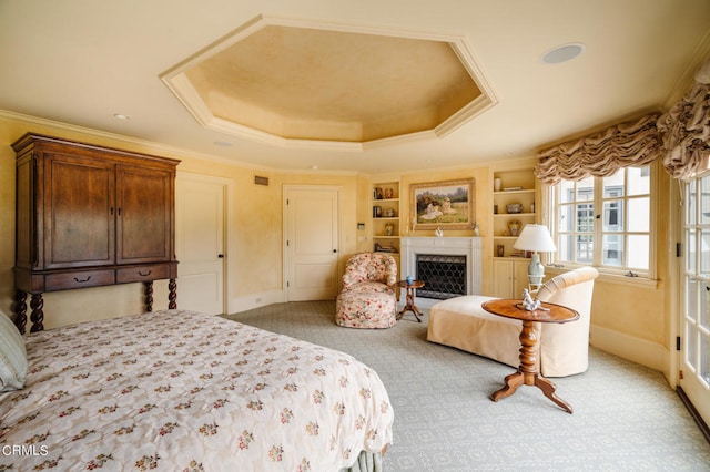 bedroom with a raised ceiling and ornamental molding