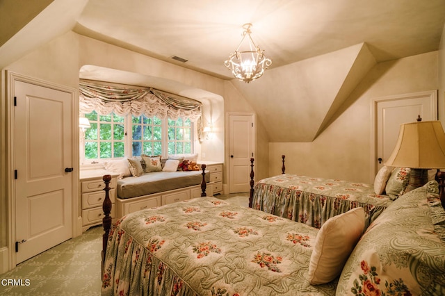 bedroom with lofted ceiling, light colored carpet, and an inviting chandelier