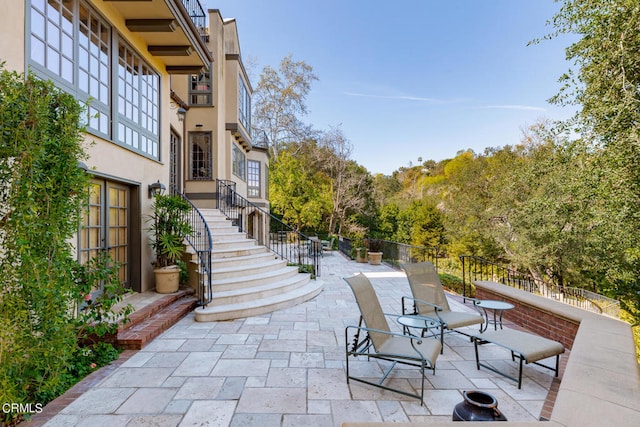 view of property's community featuring a patio