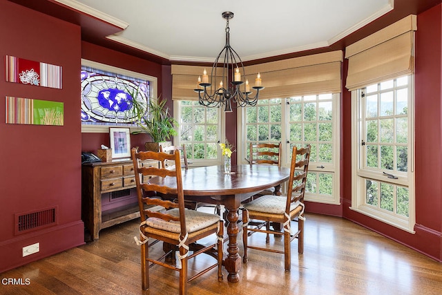 dining room featuring hardwood / wood-style flooring and a healthy amount of sunlight