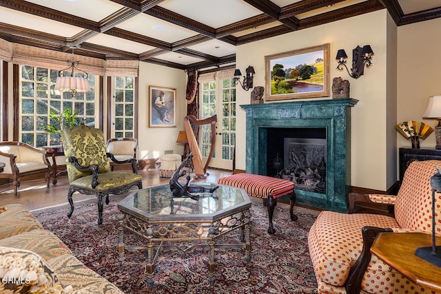 living area featuring coffered ceiling, crown molding, beam ceiling, and a high end fireplace