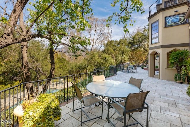 view of patio with a balcony