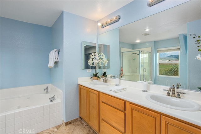 bathroom featuring a garden tub, double vanity, a stall shower, and a sink