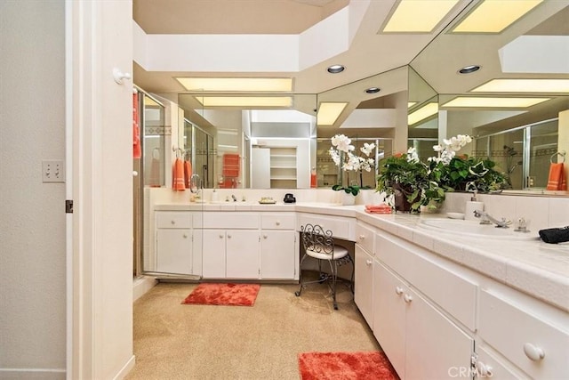 bathroom with vanity and walk in shower