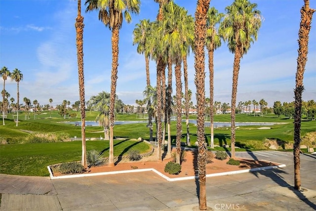 128 Desert Falls Dr E, Palm Desert, CA 92211 - view of property's community featuring golf course view, a water view, and a yard
